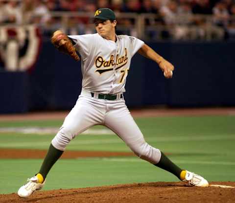 Oakland Athletics winning pitcher Barry Zito throws a pitch against the Minnesota Twins in the seventh inning of Game 3 of their American League Divisional Series game, 04 October 2002, at the Metrodome in Minneapolis, Minnesota. Oakland won 6-3. AFP PHOTO/CRAIG LASSIG (Photo by CRAIG LASSIG / AFP) (Photo by CRAIG LASSIG/AFP via Getty Images)