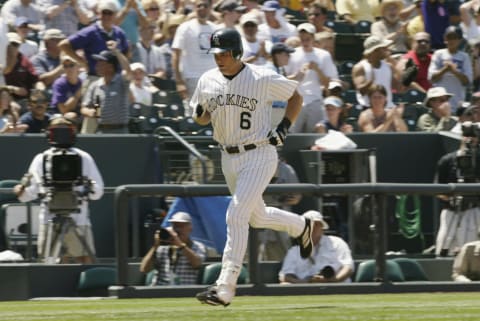 DENVER – JULY 18: Catcher Ben Petrick #6 of the Colorado Rockies jogs to home plate after hitting a solo home run during the MLB game against the Arizona Diamondbacks on July 18, 2002 at Coors Field in Denver, Colorado. The Rockies won 6-4. (Photo by Brian Bahr/Getty Images)