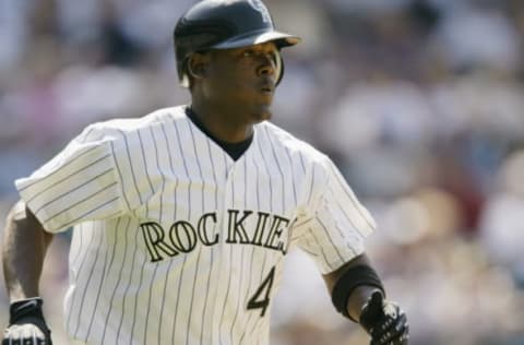 DENVER – JULY 18: Shortstop Juan Uribe #4 of the Colorado Rockies watches the flight of the ball during the MLB game against the Arizona Diamondbacks on July 18, 2002 at Coors Field in Denver, Colorado. The Rockies won 6-4. (Photo by Brian Bahr/Getty Images)