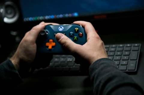 TURIN, ITALY – MARCH 15: A man plays a video game at home to pass the time after the Italian government clamped down on public events, closed bars, restaurants and schools, imposed travel restrictions and advised citizens to stay at home in an attempt to slow the spread of the Coronavirus on March 15, 2020 in Turin, Italy. Italy has been the worst hit county outside of China, with over 24,747 confirmed cases of COVID-19 and as many as 1,809 fatalities. (Photo by Stefano Guidi/Getty Images)