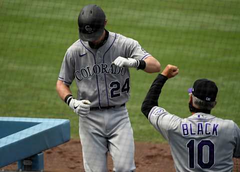 LOS ANGELES, CA – AUGUST 23: Ryan McMahon #24 of the Colorado Rockies is congratulated by manage Bud Black #10 after hitting a one run home run against pitcher Ross Stripling #68 of the Los Angeles Dodgers during the fourth inning at Dodger Stadium on August 23, 2020 in Los Angeles, California. (Photo by Kevork Djansezian/Getty Images)