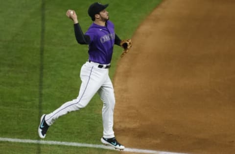 DENVER, CO – AUGUST 31: Nolan Arenado #28 of the Colorado Rockies makes a leaping throw to first base for the second out of the sixth inning against the San Diego Padres at Coors Field on August 31, 2020 in Denver, Colorado. (Photo by Justin Edmonds/Getty Images)