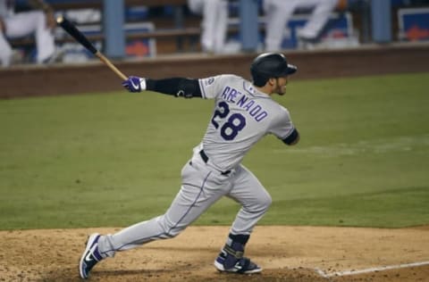 LOS ANGELES, CA – SEPTEMBER 06: Nolan Arenado #28 of the Colorado Rockies hits a base hit to score Raimel Tapia #15 of the Colorado Rockies from third base during the fifth inning against the Los Angeles Dodgers at Dodger Stadium on September 6, 2020 in Los Angeles, California. (Photo by Kevork Djansezian/Getty Images)