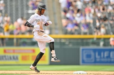 DENVER, CO – JUNE 16: Raimel Tapia #15 of the Colorado Rockies celebrates after reaching second base with a double in the fourth inning of a game at Coors Field on June 16, 2021 in Denver, Colorado. (Photo by Dustin Bradford/Getty Images)