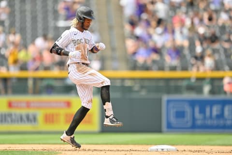 DENVER, CO – JUNE 16: Raimel Tapia #15 of the Colorado Rockies celebrates after reaching second base with a double in the fourth inning of a game at Coors Field on June 16, 2021 in Denver, Colorado. (Photo by Dustin Bradford/Getty Images)