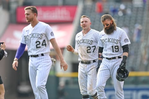 DENVER, CO – JUNE 16: Charlie Blackmon #19 and Trevor Story #27 of the Colorado Rockies walk off the field after Blackmon hit an RBI single to drive in a run by Story for a walk off in the ninth inning against the San Diego Padres at Coors Field on June 16, 2021 in Denver, Colorado. (Photo by Dustin Bradford/Getty Images)