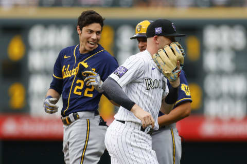 DENVER, CO – JUNE 18: Christian Yelich #22 of the Milwaukee Brewers shares a laugh with Trevor Story #27 of the Colorado Rockies after Story made a diving catch on a ball off the bat of Yelich during the first inning at Coors Field on June 18, 2021 in Denver, Colorado. (Photo by Justin Edmonds/Getty Images)