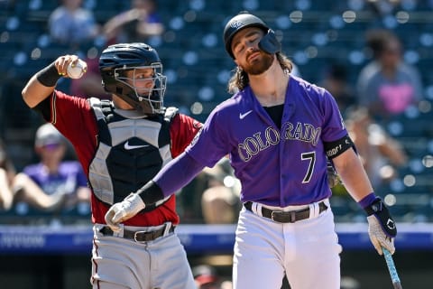 DENVER, CO – AUGUST 22: Brendan Rodgers #7 of the Colorado Rockies reacts after striking out in the fifth inning as Daulton Varsho #12 of the Arizona Diamondbacks returns the ball at Coors Field on August 22, 2021 in Denver, Colorado. (Photo by Dustin Bradford/Getty Images)