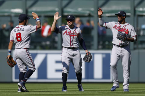 DENVER, CO – SEPTEMBER 5: (L-R) Eddie Rosario #8, Adam Duvall #14 and Jorge Soler #12 of the Atlanta Braves celebrate after their win against the Colorado Rockies at Coors Field on September 5, 2021 in Denver, Colorado. The Braves defeated the Rockies 9-2. (Photo by Justin Edmonds/Getty Images)