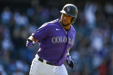 DENVER, CO – APRIL 10: Elias Diaz #35 of the Colorado Rockies points to the dugout after hitting a two-run home run in the seventh inning of a game against the Los Angeles Dodgers at Coors Field on April 10, 2022 in Denver, Colorado. (Photo by Dustin Bradford/Getty Images)