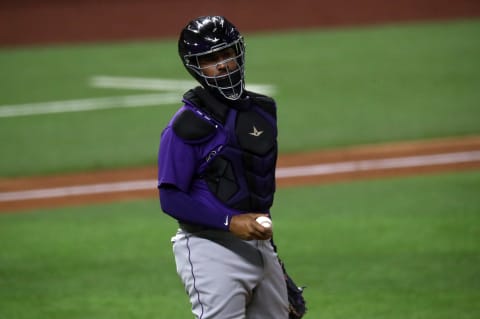 ARLINGTON, TEXAS – JULY 21: Elias Diaz #35 of the Colorado Rockies during an MLB exhibition game at Globe Life Field on July 21, 2020 in Arlington, Texas. (Photo by Ronald Martinez/Getty Images)