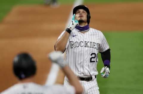 DENVER, COLORADO – AUGUST 03: Nolan Arenado #28 of the Colorado Rockies celebrates after hitting a 2 RBI home run in the sixth inning against the San Francisco Giants at Coors Field on August 03, 2020 in Denver, Colorado. (Photo by Matthew Stockman/Getty Images)