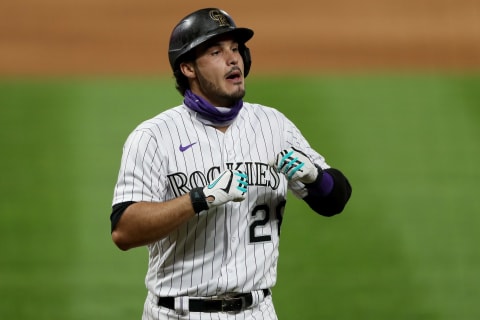 DENVER, COLORADO – AUGUST 03: Nolan Arenado #28 of the Colorado Rockies celebrates after hitting a 2 RBI home run in the sixth inning against the San Francisco Giants at Coors Field on August 03, 2020 in Denver, Colorado. (Photo by Matthew Stockman/Getty Images)