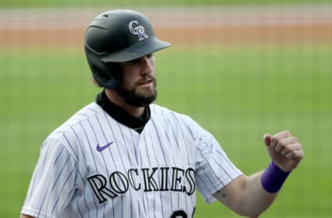 DENVER, COLORADO – AUGUST 04: David Dahl #26 of the Colorado Rockies celebrates after scoring on a sacrifice fly by Charlie Blackmon #19 in the first inning against the San Francisco Giants at Coors Field on August 04, 2020 in Denver, Colorado. (Photo by Matthew Stockman/Getty Images)