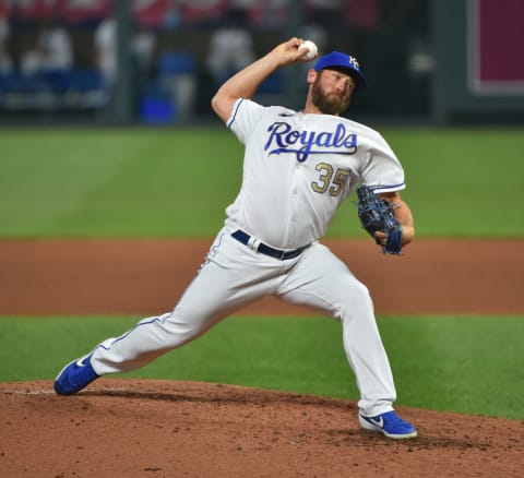 KANSAS CITY, MISSOURI – AUGUST 07: Relief pitcher Greg Holland #35 of the Kansas City Royals throws a pitch in the fifth inning against the Minnesota Twins at Kauffman Stadium on August 07, 2020 in Kansas City, Missouri. (Photo by Ed Zurga/Getty Images)