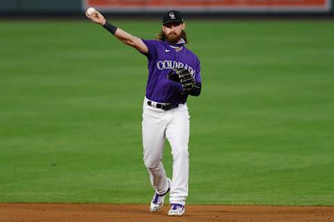 DENVER, CO – AUGUST 19: Brendan Rodgers #7 of the Colorado Rockies throws the ball to first while warming up during the eighth inning against the Houston Astros at Coors Field on August 19, 2020 in Denver, Colorado. The Astros defeated the Rockies for the third straight game, winning 13-6. (Photo by Justin Edmonds/Getty Images)