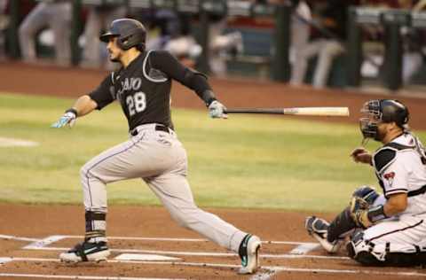 PHOENIX, ARIZONA – AUGUST 24: Nolan Arenado #28 of the Colorado Rockies hits a single against the Arizona Diamondbacks during the first inning of the MLB game at Chase Field on August 24, 2020 in Phoenix, Arizona. (Photo by Christian Petersen/Getty Images)