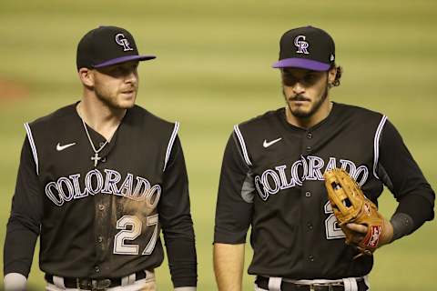 PHOENIX, ARIZONA – AUGUST 24: Infielders Trevor Story #27 and Nolan Arenado #28 of the Colorado Rockies during the MLB game against the Arizona Diamondbacks at Chase Field on August 24, 2020 in Phoenix, Arizona. The Rockies defeated the Diamondbacks 3-2. (Photo by Christian Petersen/Getty Images)