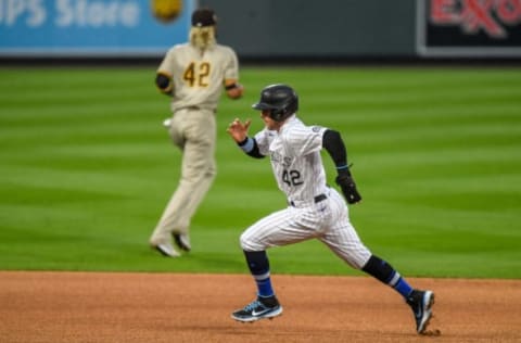 DENVER, CO – AUGUST 28: Trevor Story #42 of the Colorado Rockies runs from first to third against the San Diego Padres at Coors Field on August 28, 2020 in Denver, Colorado. All players are wearing #42 in honor of Jackie Robinson Day. The day honoring Jackie Robinson, traditionally held on April 15, was rescheduled due to the COVID-19 pandemic. (Photo by Dustin Bradford/Getty Images)