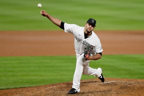 DENVER, COLORADO – SEPTEMBER 17: Pitcher Carlos Estevez #54 of the Colorado Rockies throws in the seventh inning against the Los Angeles Dodgers at Coors Field on September 17, 2020 in Denver, Colorado. (Photo by Matthew Stockman/Getty Images)