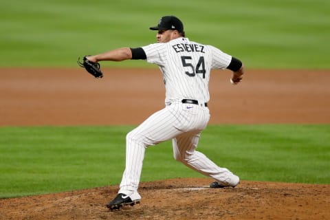 DENVER, COLORADO – SEPTEMBER 17: Pitcher Carlos Estevez #54 of the Colorado Rockies throws in the seventh inning against the Los Angeles Dodgers at Coors Field on September 17, 2020 in Denver, Colorado. (Photo by Matthew Stockman/Getty Images)