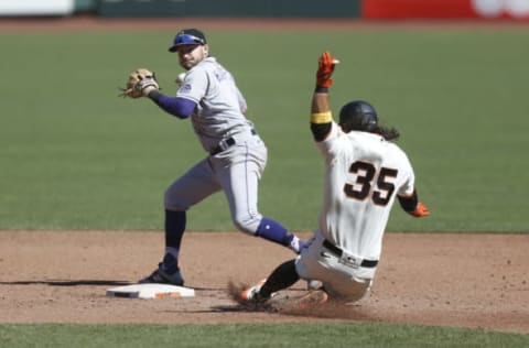 SAN FRANCISCO, CALIFORNIA – SEPTEMBER 24: Garrett Hampson #1 of the Colorado Rockies gets the out at second base of Brandon Crawford #35 of the San Francisco Giants and throws to first base to get a double play in the bottom of the third inning at Oracle Park on September 24, 2020 in San Francisco, California. (Photo by Lachlan Cunningham/Getty Images)