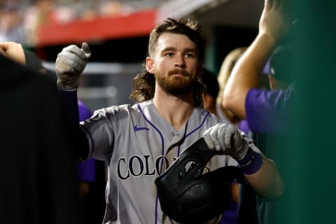 CINCINNATI, OH – JUNE 11: Brendan Rodgers #7 of the Colorado Rockies is congratulated by his teammates after scoring a run during the game against the Cincinnati Reds at Great American Ball Park on June 11, 2021 in Cincinnati, Ohio. Cincinnati defeated Colorado 11-5. (Photo by Kirk Irwin/Getty Images)