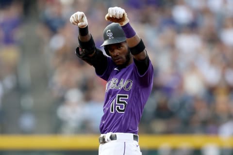 DENVER, COLORADO – JUNE 19: Raimel Tapia #15 of the Colorado Rockies reacts on second base after hitting a double against the Milwaukee Brewers in the first inning at Coors Field on June 19, 2021 in Denver, Colorado. (Photo by Matthew Stockman/Getty Images)