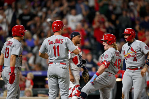 DENVER, CO – JULY 02: Harrison Bader #48 of the St. Louis Cardinals celebrates with Tommy Edman #19, Paul DeJong #11, and Yadier Molina #4 after hitting a 10th inning grand slam homerun against the Colorado Rockies at Coors Field on July 2, 2021 in Denver, Colorado. (Photo by Dustin Bradford/Getty Images)