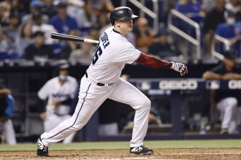 MIAMI, FLORIDA – JULY 05: Garrett Cooper #26 of the Miami Marlins hits a RBI single during the third inning against the Los Angeles Dodgers at loanDepot park on July 05, 2021 in Miami, Florida. (Photo by Michael Reaves/Getty Images)