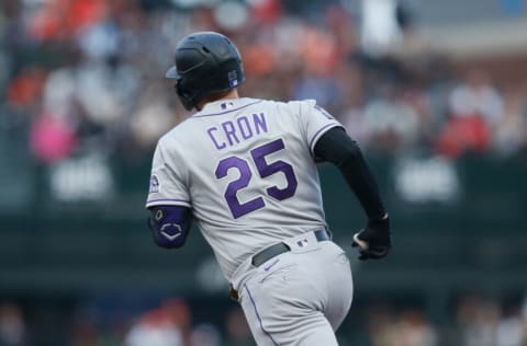 SAN FRANCISCO, CALIFORNIA - AUGUST 14: C.J. Cron #25 of the Colorado Rockies rounds the bases after hitting a solo home run in the top of the second inning against the San Francisco Giants at Oracle Park on August 14, 2021 in San Francisco, California. (Photo by Lachlan Cunningham/Getty Images)