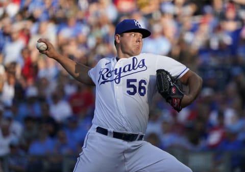 KANSAS CITY, MISSOURI – AUGUST 14: Brad Keller #56 of the Kansas City Royals throws in the second inning against the St. Louis Cardinals at Kauffman Stadium on August 14, 2021 in Kansas City, Missouri. (Photo by Ed Zurga/Getty Images)