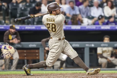 DENVER, CO – AUGUST 17: Tommy Pham #28 of the San Diego Padres hits an 486-foot home run against the Colorado Rockies during the seventh inning at Coors Field on August 17, 2021 in Denver, Colorado. The hit was the longest home run in the Majors this season and the second longest home run ever recorded by Statcast for a Padre. (Photo by Michael Ciaglo/Getty Images)