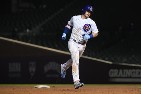 CHICAGO, ILLINOIS – AUGUST 25: Ian Happ #8 of the Chicago Cubs rounds the bases after his three run home run in the seventh inning against the Colorado Rockies at Wrigley Field on August 25, 2021 in Chicago, Illinois. (Photo by Quinn Harris/Getty Images)