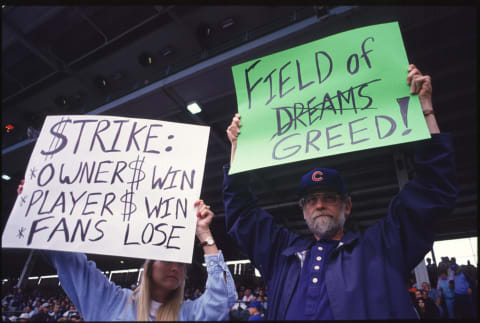 CHICAGO – AUGUST 10: Fans hold up signs in protest of the baseball strike during a game between the San Francisco Giants and the Chicago Cubs at Wrigley Field in Chicago, Illinios. The Giants won the game 5-2.(Photo by Jonathan Daniel/Getty Images)