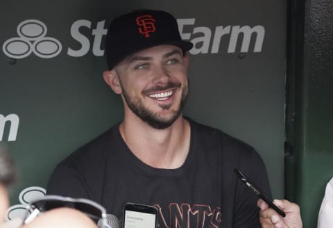 CHICAGO, ILLINOIS – SEPTEMBER 10: Kris Bryant #23 of the San Francisco Giants speaks with reporters in the dugout prior to a game against the Chicago Cubs at Wrigley Field on September 10, 2021 in Chicago, Illinois. Today’s game was Bryant’s first time back at Wrigley Field since he was traded by the Cubs. (Photo by Nuccio DiNuzzo/Getty Images)