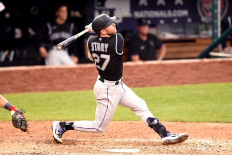 WASHINGTON, DC – SEPTEMBER 18: Trevor Story #27 of the Colorado Rockies takes a swing during a baseball game against the Washington Nationals at Nationals Park on September 18, 2021 in Washington, DC. (Photo by Mitchell Layton/Getty Images)