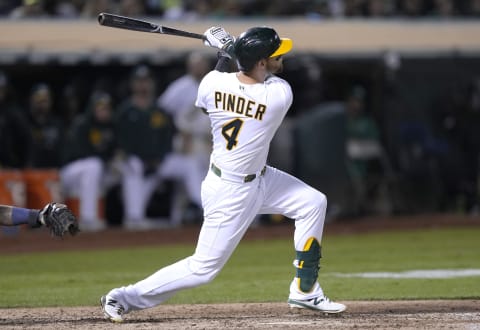 OAKLAND, CALIFORNIA – SEPTEMBER 24: Chad Pinder #4 of the Oakland Athletics hits a pinch hit grand slam home run against the Houston Astros in the bottom of the seventh inning at RingCentral Coliseum on September 24, 2021 in Oakland, California. (Photo by Thearon W. Henderson/Getty Images)