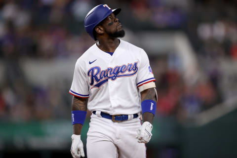 ARLINGTON, TEXAS – SEPTEMBER 29: Adolis Garcia #53 of the Texas Rangers reacts after flying out against the Los Angeles Angels in the bottom of the fourth inning at Globe Life Field on September 29, 2021 in Arlington, Texas. (Photo by Tom Pennington/Getty Images)