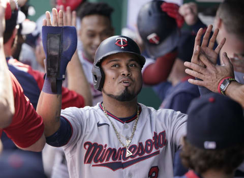 KANSAS CITY, MISSOURI – OCTOBER 03: Luis Arraez #2 of the Minnesota Twins celebrates with teammates after scoring on a Jorge Polanco three-run home run against the Kansas City Royals in the first inning at Kauffman Stadium on October 03, 2021 in Kansas City, Missouri. (Photo by Ed Zurga/Getty Images)