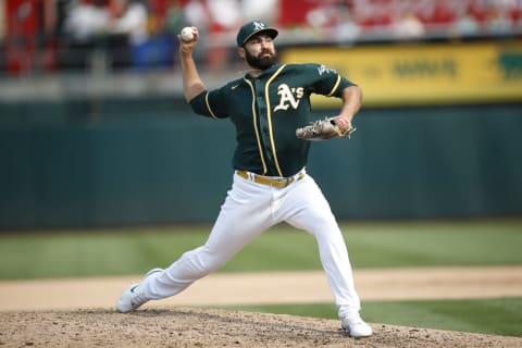 OAKLAND, CA – SEPTMEBER 25: Lou Trivino #62 of the Oakland Athletics pitches during the game against the Houston Astros at RingCentral Coliseum on September 25, 2021 in Oakland, California. The Athletics defeated the Astros 2-1. (Photo by Michael Zagaris/Oakland Athletics/Getty Images)