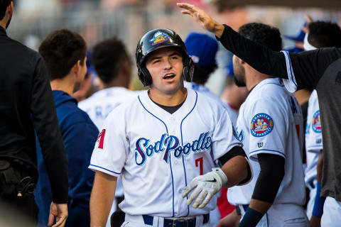 AMARILLO, TEXAS – SEPTEMBER 18: Infielder Buddy Kennedy #7 of the Amarillo Sod Poodles celebrates with teammates after hitting a home run during the game against the Frisco RoughRiders at HODGETOWN Stadium on September 18, 2021 in Amarillo, Texas. (Photo by John E. Moore III/Getty Images)