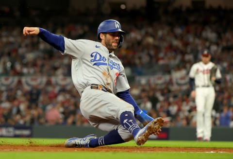 ATLANTA, GEORGIA – OCTOBER 17: Chris Taylor #3 of the Los Angeles Dodgers slides into third base to advance on a sacrifice fly against the Atlanta Braves in the sixth inning of Game Two of the National League Championship Series at Truist Park on October 17, 2021 in Atlanta, Georgia. (Photo by Kevin C. Cox/Getty Images)