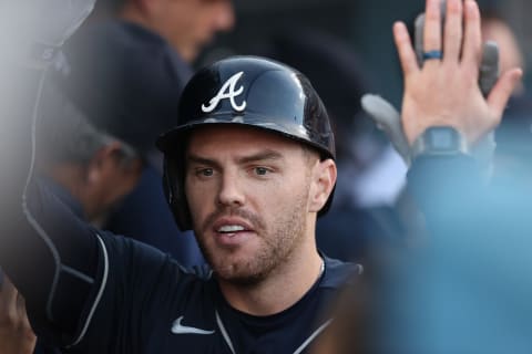 LOS ANGELES, CALIFORNIA – OCTOBER 21: Freddie Freeman #5 of the Atlanta Braves is congratulated by teammates following a two run home run during the first inning of Game Five of the National League Championship Series against the Los Angeles Dodgers at Dodger Stadium on October 21, 2021 in Los Angeles, California. (Photo by Ronald Martinez/Getty Images)