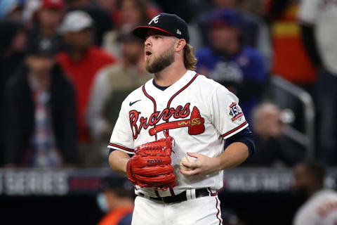 ATLANTA, GEORGIA – OCTOBER 31: A.J. Minter #33 of the Atlanta Braves reacts after walking in a run against the Houston Astros during the fifth inning in Game Five of the World Series at Truist Park on October 31, 2021 in Atlanta, Georgia. (Photo by Elsa/Getty Images)