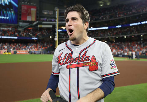 HOUSTON, TEXAS – NOVEMBER 02: Luke Jackson #77 of the Atlanta Braves celebrates on the field after defeating the Houston Astros 7-0 in Game Six of the World Series at Minute Maid Park on November 02, 2021 in Houston, Texas. (Photo by Elsa/Getty Images)