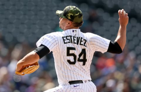 DENVER, COLORADO - MAY 21: Pitcher Carlos Estevez #54 of the Colorado Rockies throws against the New York Mets in the ninth inning during Game One of double header at Coors Field on May 21, 2022 in Denver, Colorado. (Photo by Matthew Stockman/Getty Images)