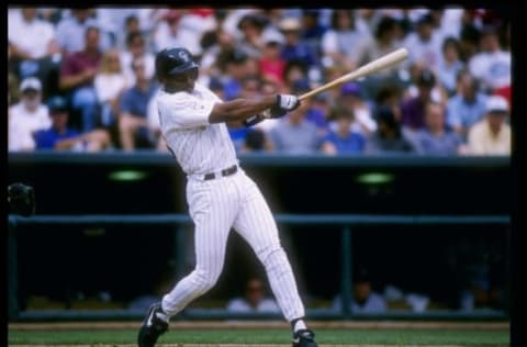 12 Jun 1996: Center fielder Ellis Burks of the Colorado Rockies swings at the ball during a game against the Houston Astros at Coors Field in Denver, Colorado. The Rockies won the game 8-0. Mandatory Credit: Stephen Dunn /Allsport