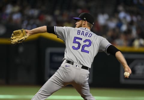 PHOENIX, ARIZONA – JULY 10: Daniel Bard #52 of the Colorado Rockies delivers a pitch against the Arizona Diamondbacks at Chase Field on July 10, 2022 in Phoenix, Arizona. (Photo by Norm Hall/Getty Images)