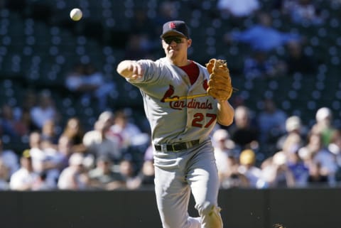 DENVER – SEPTEMBER 19: Third baseman Scott Rolen #27 of the St. Louis Cardinals throws to first base during the MLB game against the Colorado Rockies on September 19, 2002, at Coors Field in Denver, Colorado. The Cardinals won 12-6. (Photo by Brian Bahr/Getty Images)